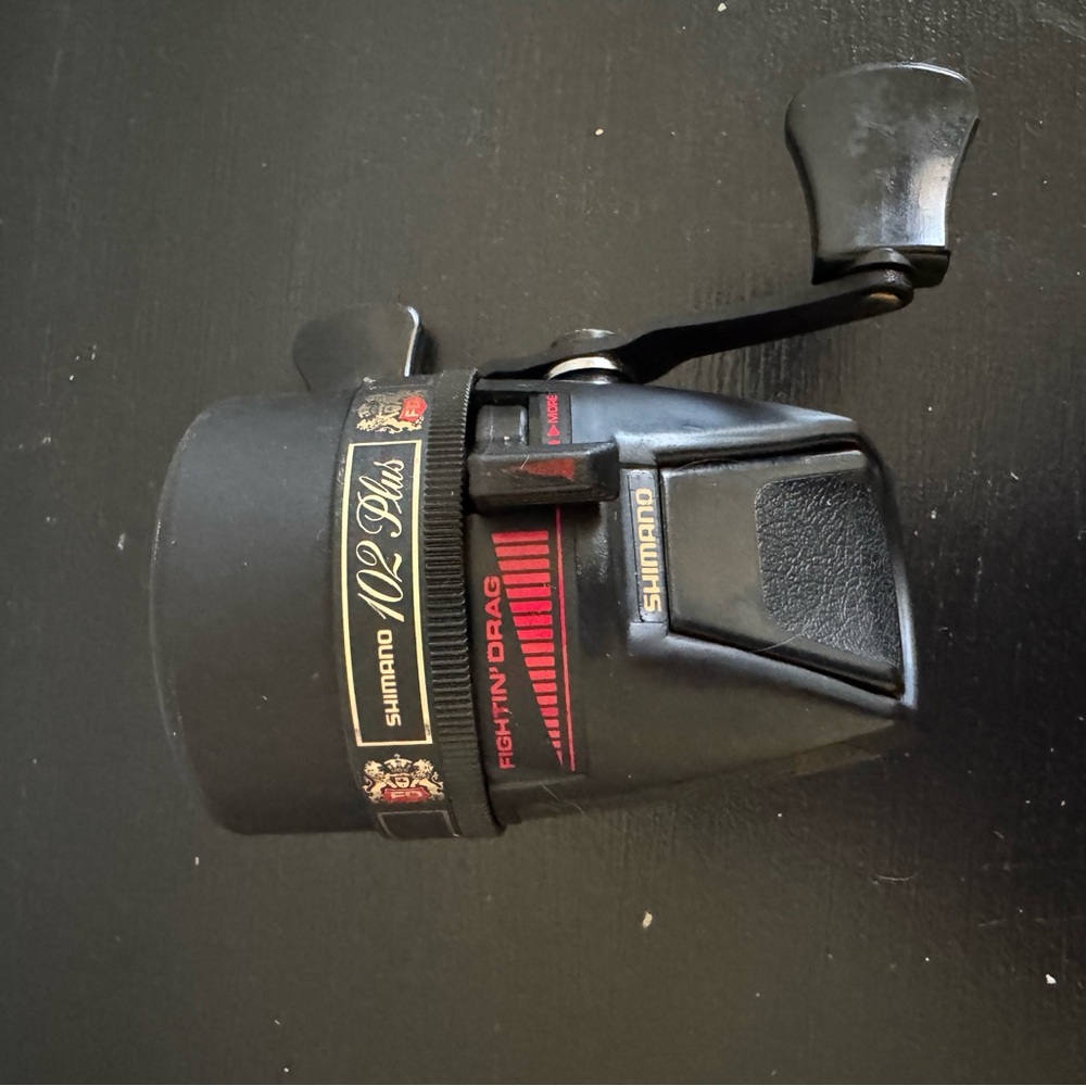 Shimano Black Spincast Reel with Red Accents